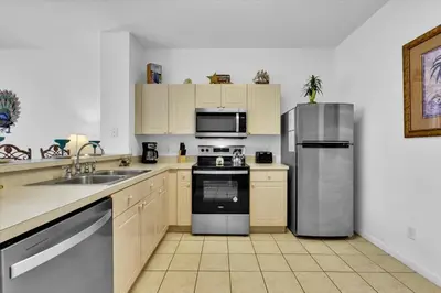 a kitchen with a stainless steel refrigerator and a sink at 2319 Silver Palm in Kissimmee