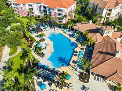 an overhead view of a swimming pool at a resort at Lake Front Huge by clubhouse in Orlando