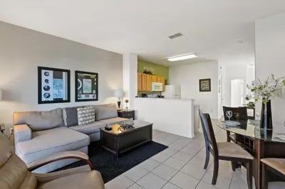 a living room with a couch and a table at 2563 Maneshaw in Orlando