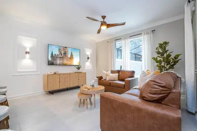 a living room with a couch and a table at Wonderfull home near Disney & FREE Waterpark 2421 in Kissimmee
