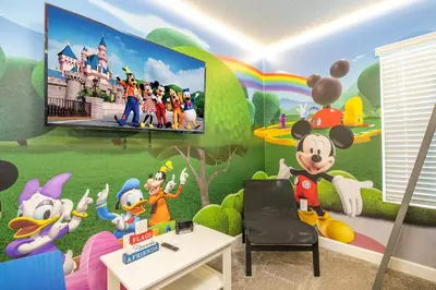 a room with a mickey mouse mural on the wall at Disney adventure resort style free waterpark2633 in Kissimmee