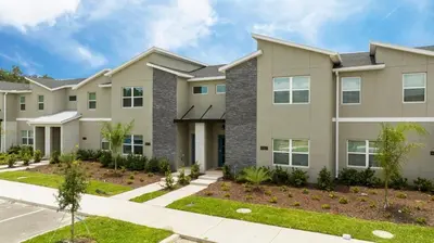 a large apartment building with a driveway at Pro decor Disney Resort style FREE Waterpark 4467 in Kissimmee