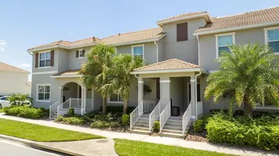 a house with palm trees in front of it at lion king affordable home & free waterpark 4913 in Kissimmee