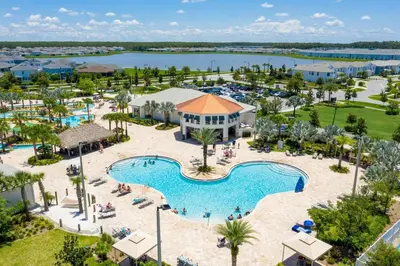 an aerial view of the pool at the resort at lion king affordable home & free waterpark 4913 in Kissimmee