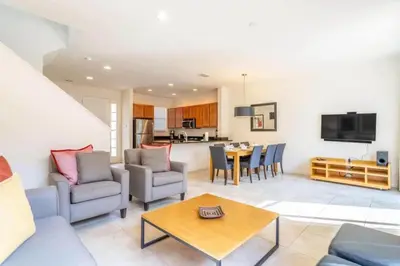 a living room with a couch and a table at Private Spa Townhome at Regal Oaks Resort in Orlando