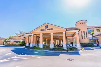 a hotel costs sign in front of a building at Private Spa Townhome at Regal Oaks Resort in Orlando