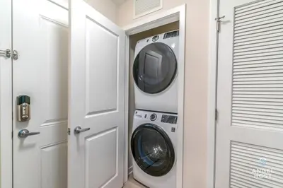 a washing machine and a washer and dryer in a room at Apartment at Vista Cay Resort in Orlando