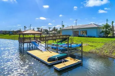 a group of inflatables on a dock in the water at Private Pool and Spa Home at Storey Lake Resort in Kissimmee