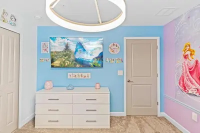 a childs room with a disney princess bedroom at 2452 Reading Trail in Kissimmee