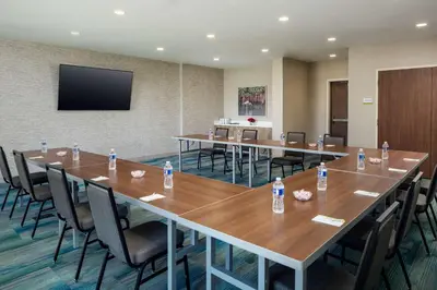 a conference room with tables and chairs with water bottles at Home2 Suites By Hilton Lake Mary Orlando in Lake Mary