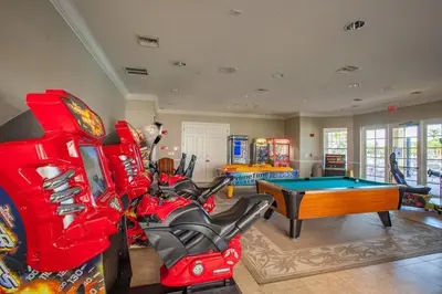 a living room with a pool table and arcade games at Apartment at Vista Cay Resort in Orlando