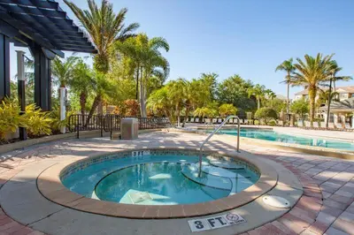 a small swimming pool in a courtyard next to a resort at Apartment at Vista Cay Resort in Orlando