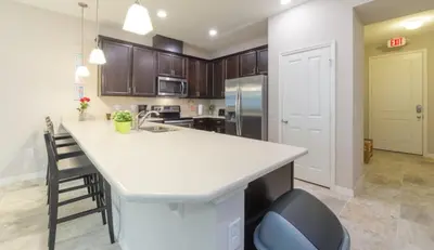 a kitchen with a white counter top in a room at Townhome at Compass Bay Community in Kissimmee