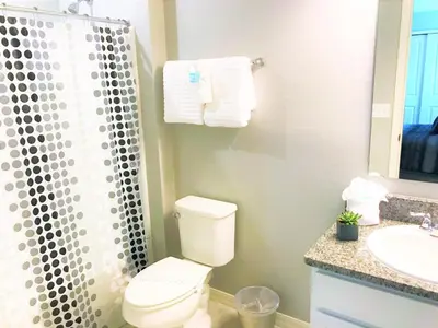 a bathroom with a toilet and a shower and a sink at Townhome at Compass Bay Community in Kissimmee
