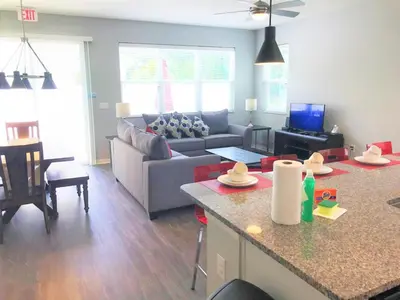 a living room with a couch and a table at Townhome at Compass Bay Community in Kissimmee
