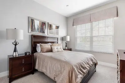 a bedroom with a large bed and a window at Fantastic 4 beds Villa 5 min to Disney in Orlando