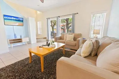a living room with a couch and a coffee table at 8536 Crystal Cove in Kissimmee