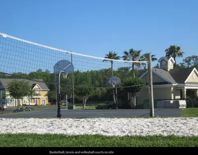 a basketball hoop in a parking lot with houses at Orlando House in Kissimmee