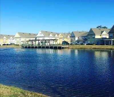a large body of water in front of houses at Orlando House in Kissimmee