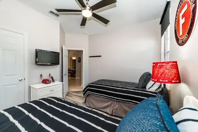 a bedroom with two beds and a ceiling fan at Private Pool Home at Windsor Palms Resort in Kissimmee