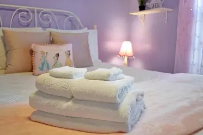 a pile of towels sitting on top of a bed at Best Family Friendly Spot at Windsor Hills in Orlando