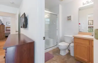 a bathroom with a toilet and a sink and a shower at Townhome at Emerald Island Resort in Kissimmee