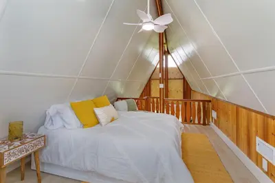 a bedroom with a bed and a ceiling fan at Hope Home in Clermont