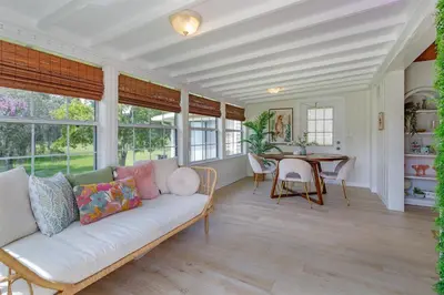 a living room with a white couch and a table at Hope Home in Clermont