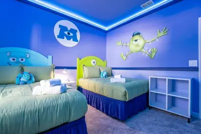 a childs bedroom with two beds and blue walls at Wonderful 5 Bd w Pool @ Storey Lake Resort 2545 in Kissimmee