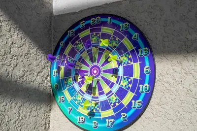 a colorful dart board hanging on a wall at Wonderful 5 Bd w Pool @ Storey Lake Resort 2545 in Kissimmee
