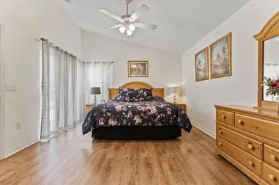 a bedroom with a bed and a ceiling fan at 4676 Cumbrian Lakes in Kissimmee