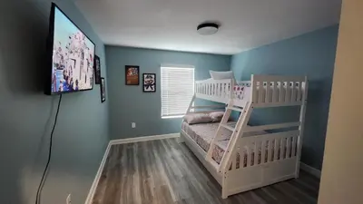 a bedroom with a bunk bed in a room at COLORING in Kissimmee