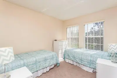 a bedroom with two beds and a window at 2764 Sun Key in Kissimmee