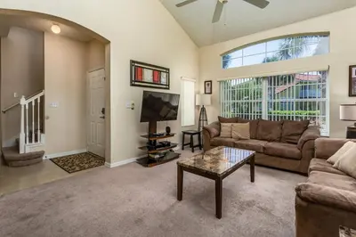 a living room with a couch and a table at 2764 Sun Key in Kissimmee
