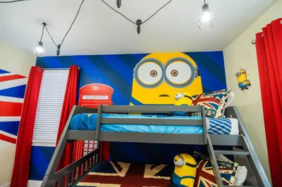 a bedroom with a bunk bed with a minion mural at Stunning Luxury 9BR Encore Villa by Disney in Orlando