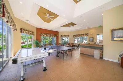 a living room with a ping pong table in it at LC-8828-12-203DC - Legacy Dunes Condo for 6 guests in Kissimmee