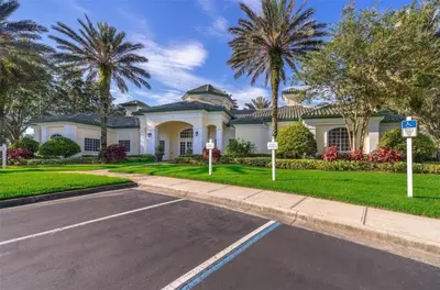 a house with palm trees in front of a street at LD8830-12-308DC - Legacy Dunes condo for 8 guests in Kissimmee