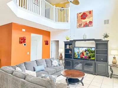 a living room with a couch and a tv at EIR8505PH - Emerald's paradise by Disney in Kissimmee