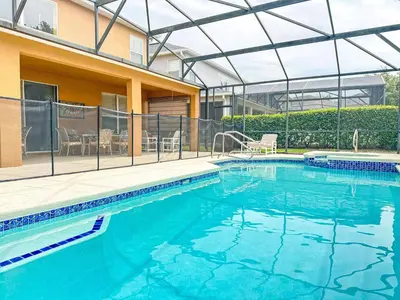 a swimming pool with a glass roof over a house at EIR8505PH - Emerald's paradise by Disney in Kissimmee