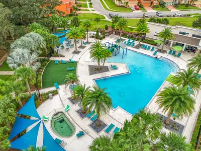 an overhead view of a pool at a resort at Tranquility Hut, Spacious 4-bedrooms, 4-bathrooms, Pools, free parking in Kissimmee