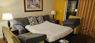 a room with a bed and a couch and a chair at Best Disney Resort Condo Orlando in Orlando