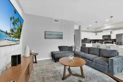 a living room with a couch and a table at 3151 Paradox #306 in Kissimmee
