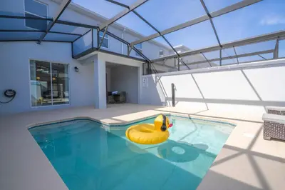a swimming pool with a yellow rubber duck in a house at Stunning 4 Bd w Pool @ Storey Lake Resort 2613 in Kissimmee