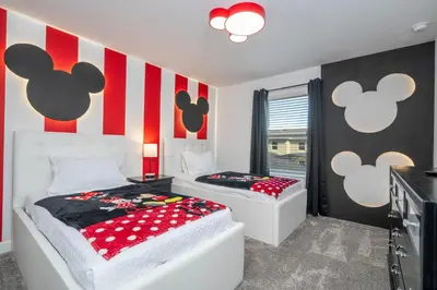 two beds in a room with red and white stripes at Stunning 4 Bd w Pool @ Storey Lake Resort 2613 in Kissimmee