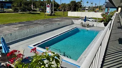 a large swimming pool with at Hotel Monte Carlo in Kissimmee