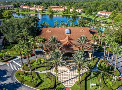 an aerial view of a resort with palm trees and a lake at Amazing 3Bdrms At Encantada- 6 miles from Disney in Kissimmee