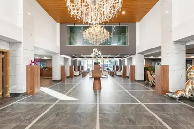 a lobby of a hotel with a chandelier at Kompose Boutique Resort @ Theme Parks in Kissimmee