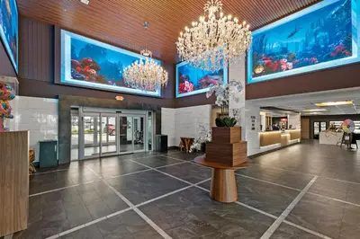 an empty lobby with an aquarium in the ceiling at Kompose Boutique Resort @ Theme Parks in Kissimmee
