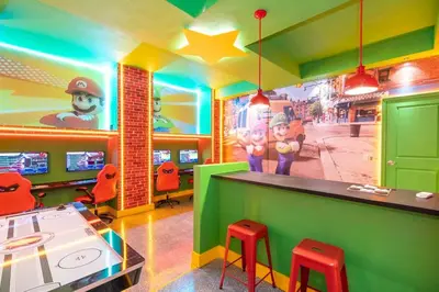 a restaurant with a bar with red stools in front at 6163 Fantastic Home with 12BD in Orlando