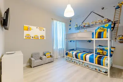 a childs bedroom with a bunk bed with a blue at Hibiscus Villa in Orlando